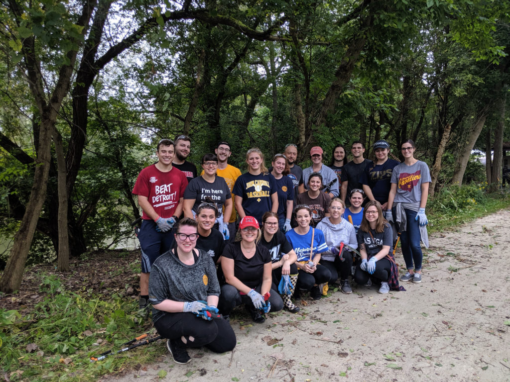 Corporate group volunteering during an invasive species clean up