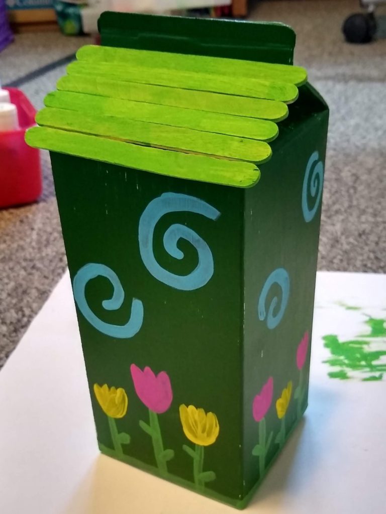 Adding roof with Popsicle sticks to DIY birdhouse