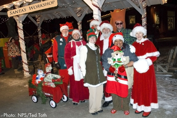 Santa and elves at santa's workshop