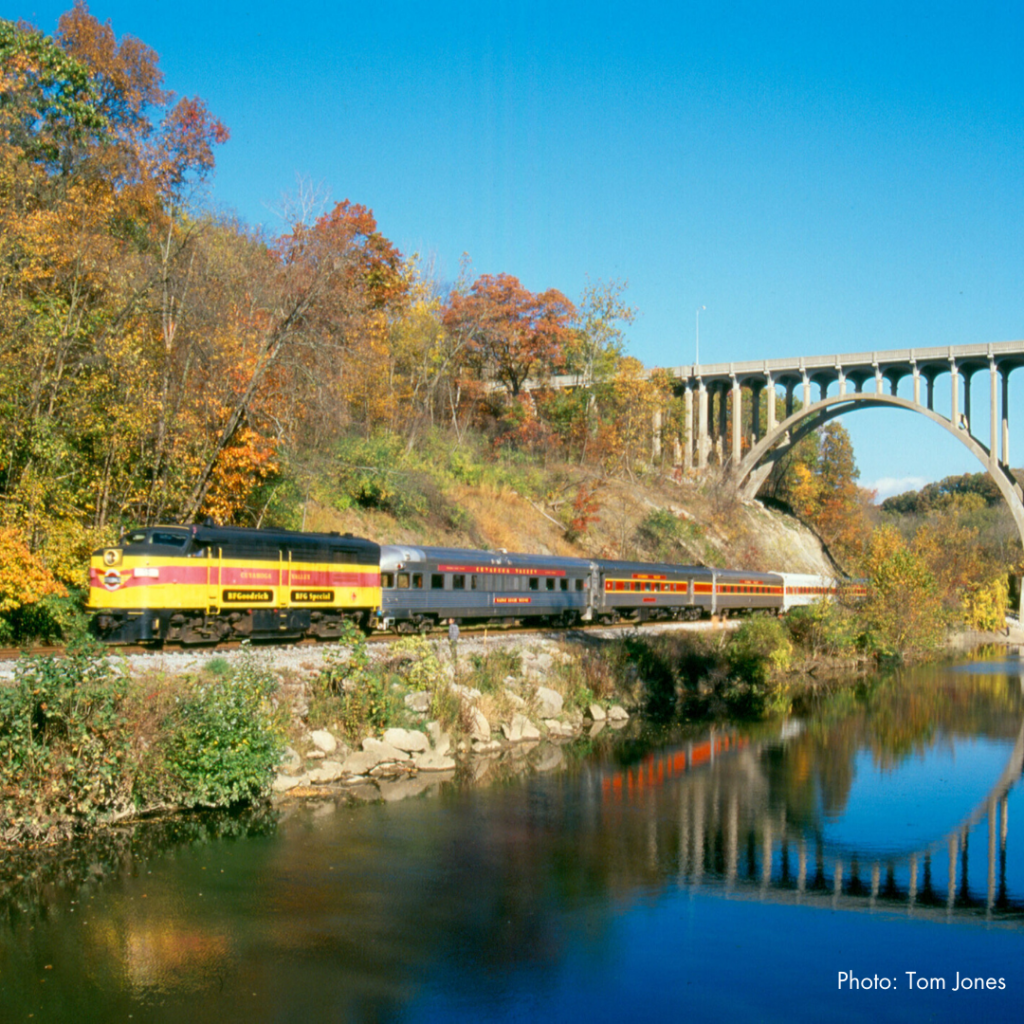 Cuyahoga Valley Scenic Railroad Train passing under bridge during the fall