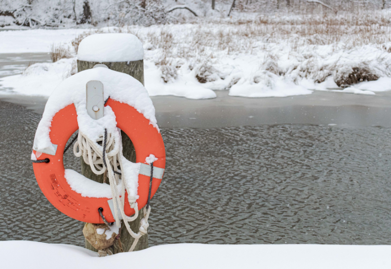 Ring buoy on a snow covered post beside Kendall Lake