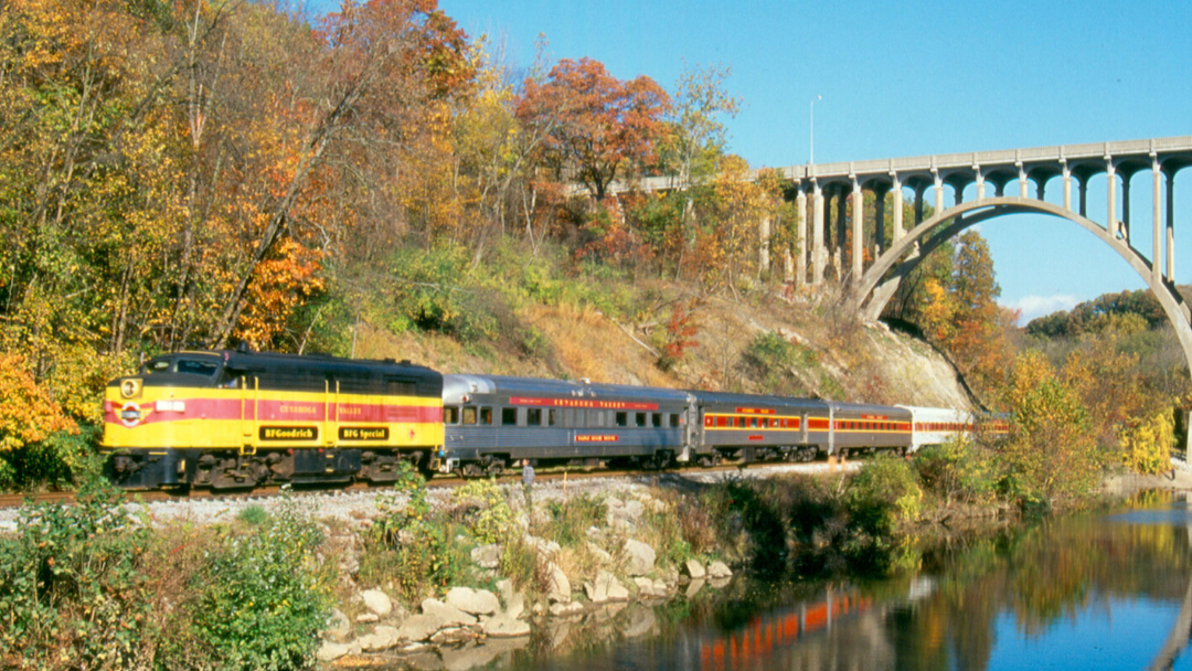 Cuyahoga Valley Scenic Railroad Train passing under bridge during the fall