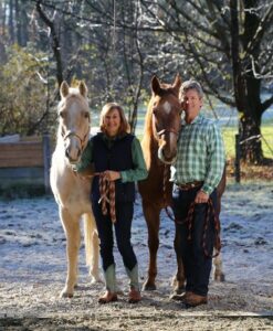 Ray and Jan Dalton post with their two horses