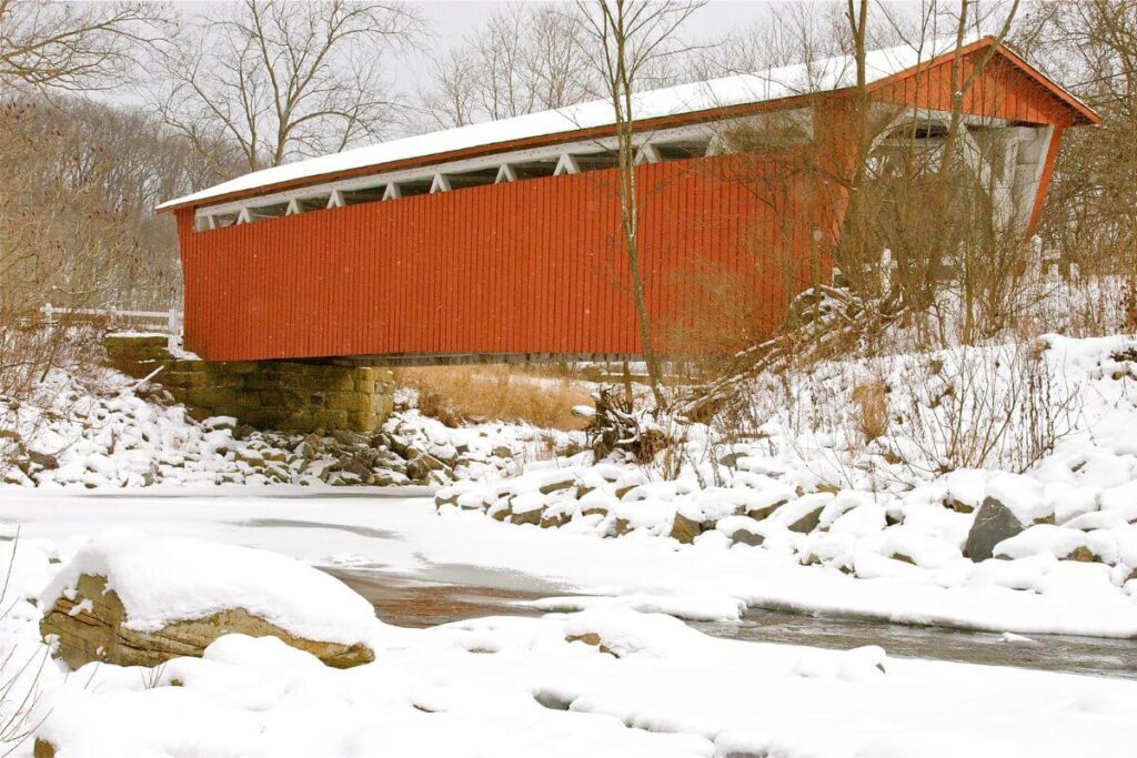 everett road covered bridge- red bridge in winter with snow
