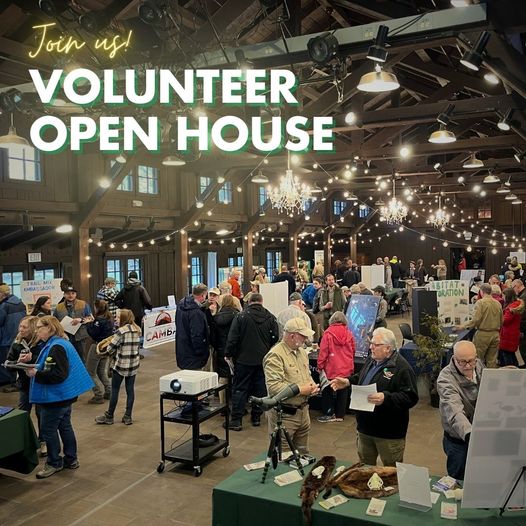 Group of people visiting tables to learn about volunteer opportunties.