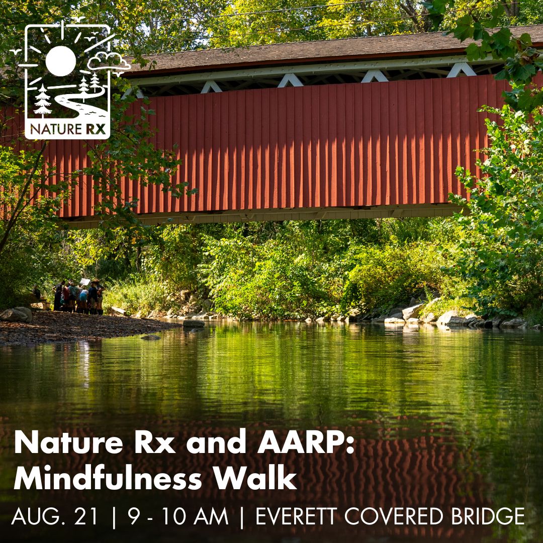 An image of a red covered bridge in Cuyahoga Valley National park serves as the background image for words that read: Nature Rx and AARP, Mindfulness Walk, Aug. 21, 9 to 10 am, Everett Covered Bridge.